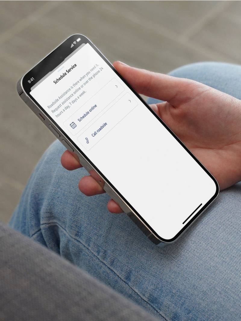 myVW mobile app screen with roadside assistance option.